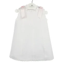Baby’s Dress in piqué fabric and pink bows.